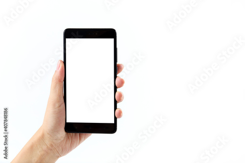 Female hand holding black smartphone with blank screen isolated on white background.