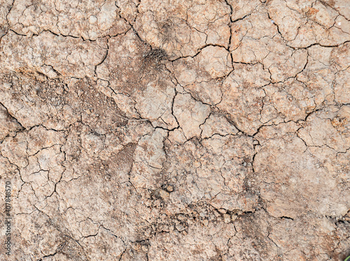 Abstract cracked soil texture background.