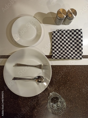 utensils on a table, dining table, plate