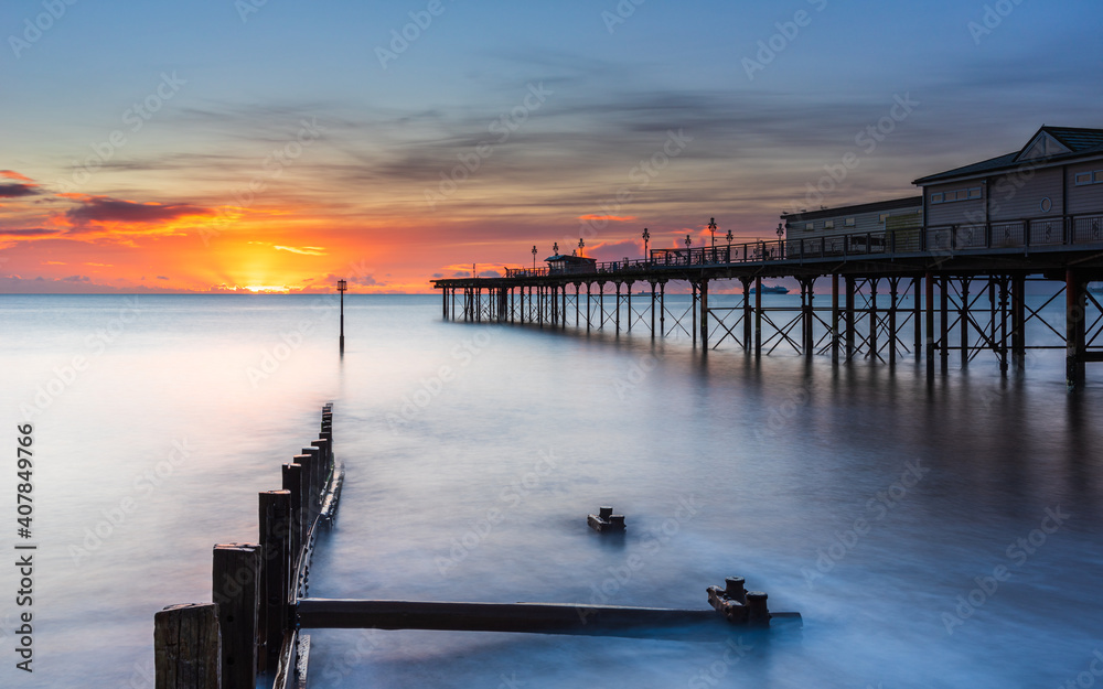 Sunrise in long time exposure of Grand Pier in Teignmouth in Devon in England, Europe