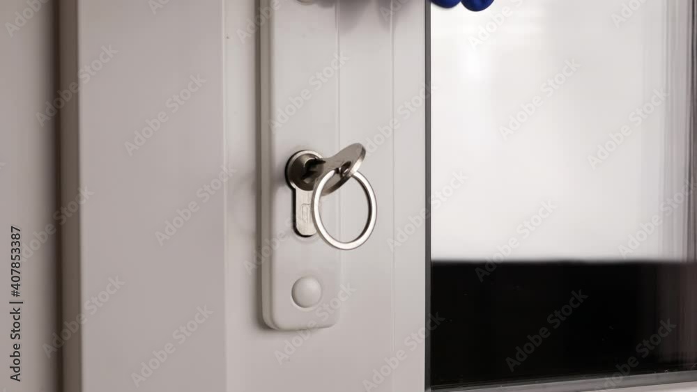 opening entrance door in a house. person unlocks and opens the door opening entrance door in a house. person unlocks and opens the door