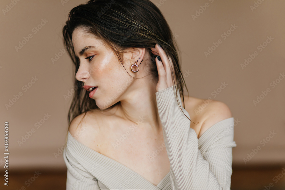 Graceful girl plays with her hair. Good-humoured pale woman enjoying shooting. Graceful girl plays with her hair. Good-humoured pale woman enjoying shooting.