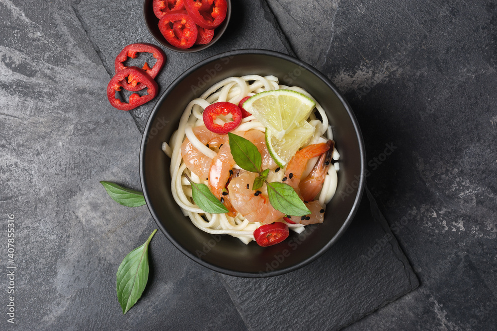 A traditional dish of Asian cuisine. Udon noodles with shrimps and red pepper