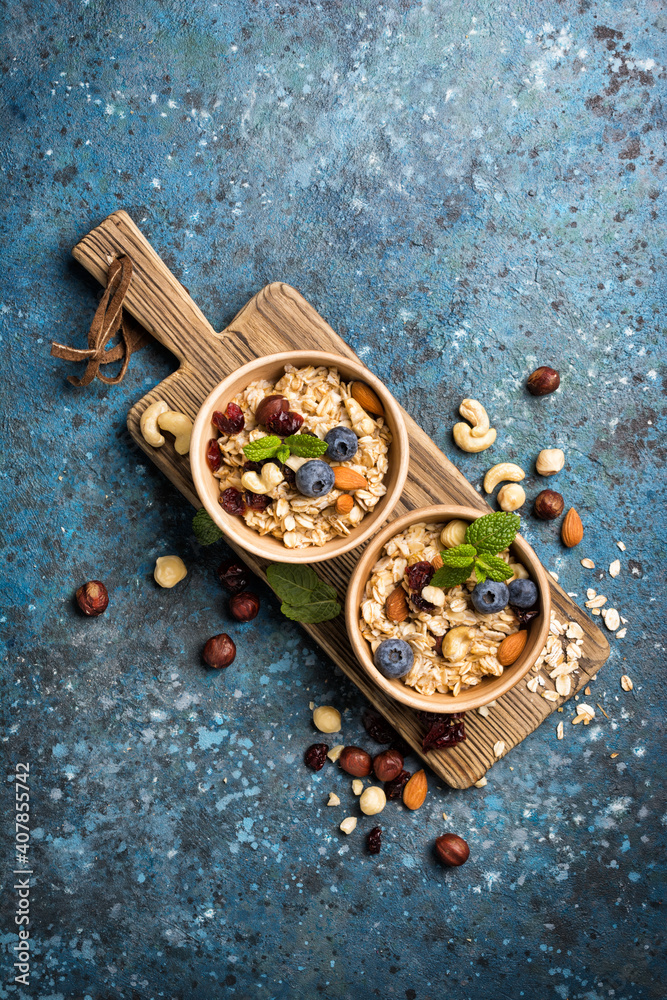 Healthy breakfast with oatmeal, berry, nuts and mint Healthy breakfast with oatmeal, berry, nuts and mint