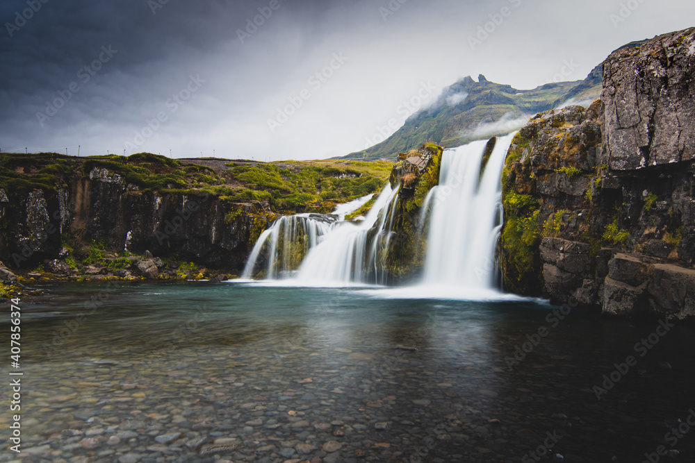 Fototapeta premium Kirkjufell foss. This is a photo taken from my home contry, Iceland. A beautiful contry yet a bit isolated. Kirkjufell is a must see place when you travel to Iceland. 