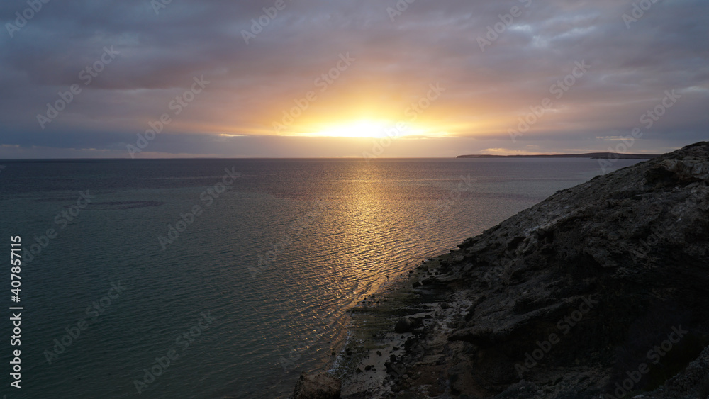 Sunset over the ocean at Shark Bay between Exmouth and Perth in Western Australia. Sunset over the ocean at Shark Bay between Exmouth and Perth in Western Australia.
