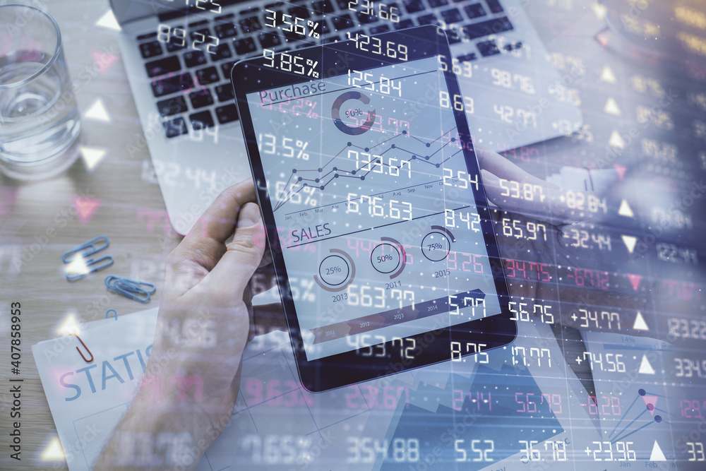 Double exposure of man's hands holding and using a digital device and forex graph drawing. Financial market concept. Double exposure of man's hands holding and using a digital device and forex graph drawing. Financial market concept.