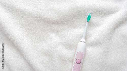 Wallpaper Mural Modern rechargeable ultrasonic electric toothbrush, white background. Concept of oral care and healthy teeth by using ultrasonic smart toothbrush, 16:9 Torontodigital.ca