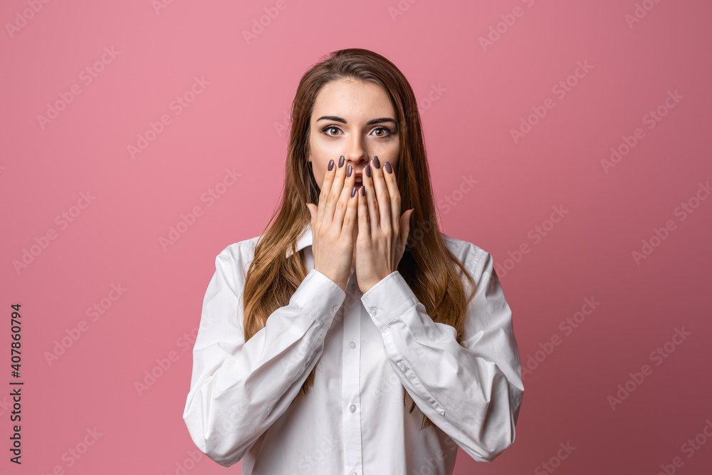 Portrait of scared brunette girl hold hands near mouth trembling fear, standing in stupor over pink background Portrait of scared brunette girl hold hands near mouth trembling fear, standing in stupor over pink background