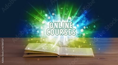 ONLINE COURSES inscription coming out from an open book, educational concept