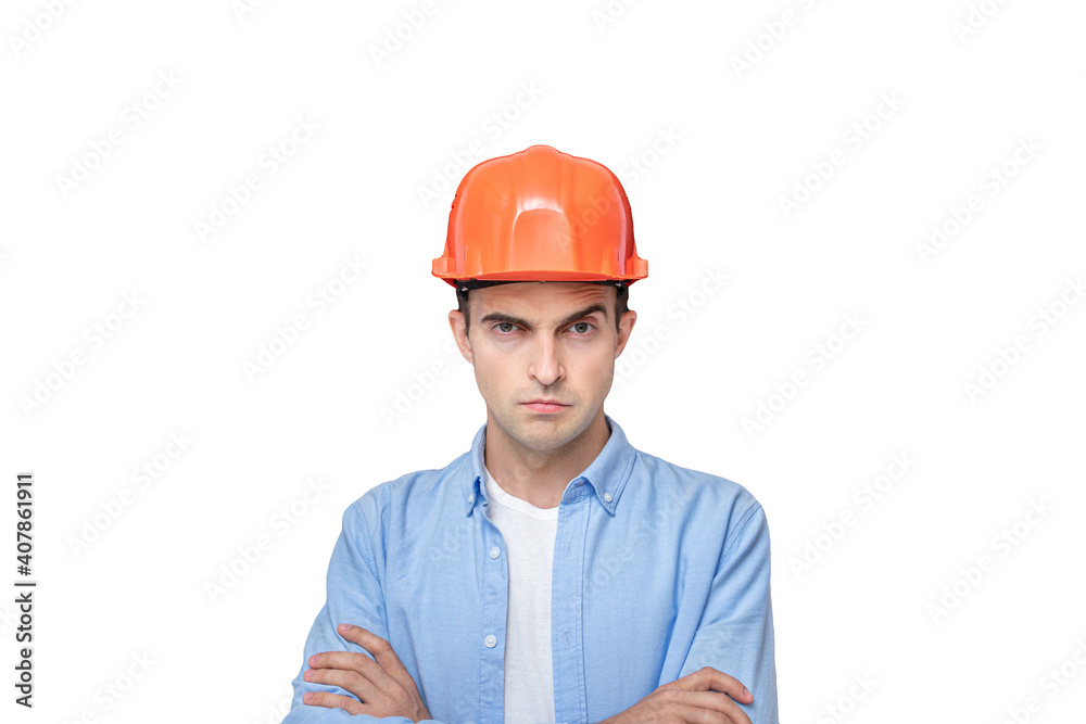 Serious constructor in helmet with his arms crossed looks at the camera,, portrait, isolated background, copy space