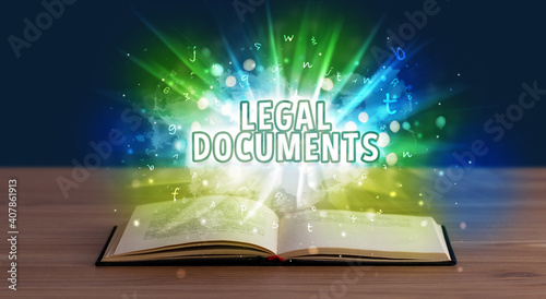 LEGAL DOCUMENTS inscription coming out from an open book, educational concept