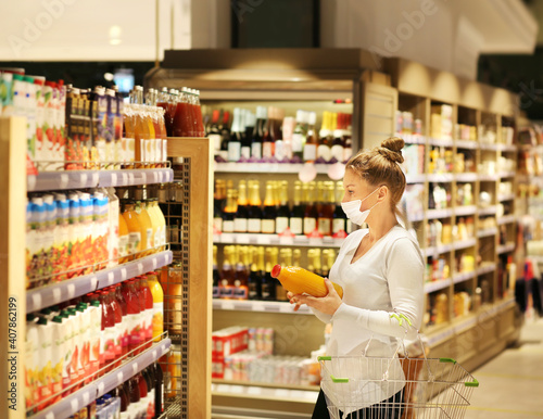 supermarket shopping, face mask and gloves,Woman choosing a dairy products at supermarket