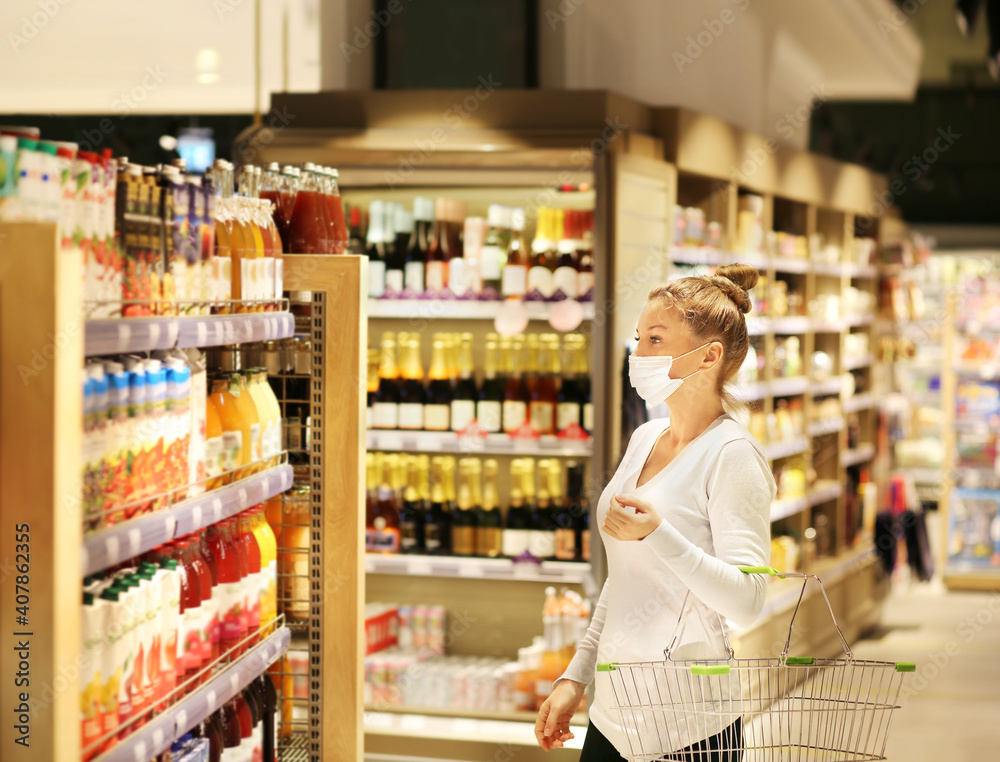 supermarket shopping, face mask and gloves,Woman choosing a dairy products at supermarket