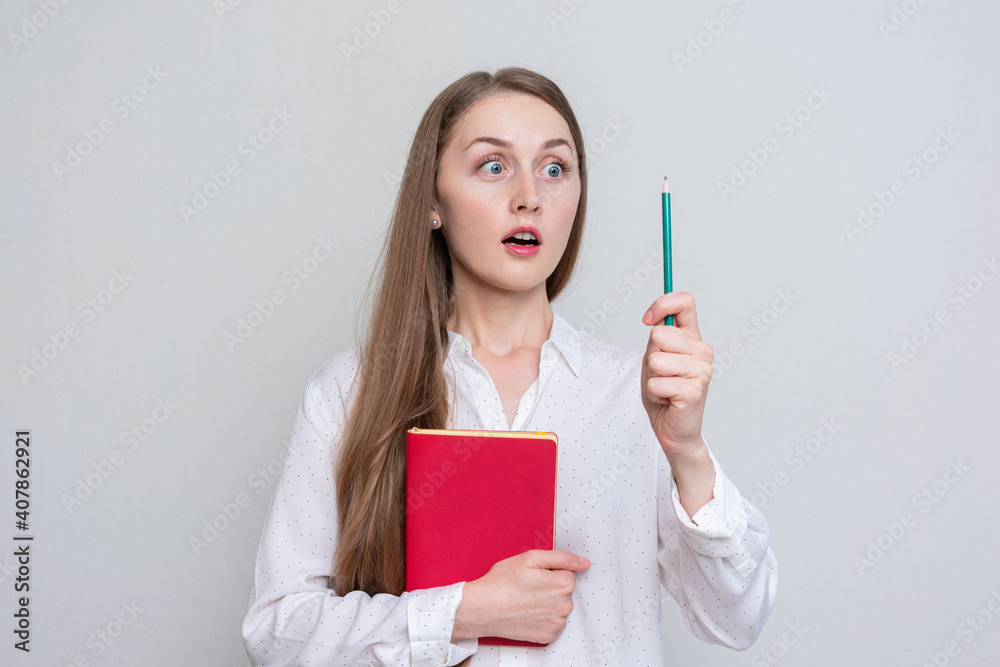 Young student woman had an idea, portrait, white background, toned Young student woman had an idea, portrait, white background, toned