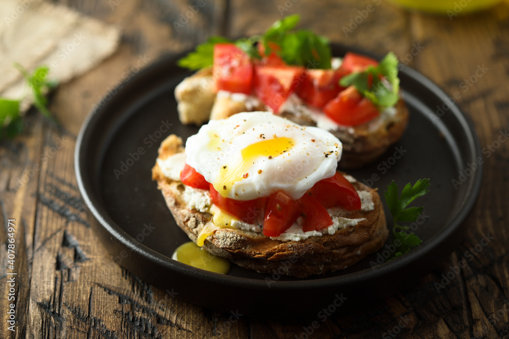 Homemade toast with tomato and poached egg