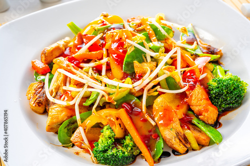 sweet and sour chicken with rice and vegetables photo