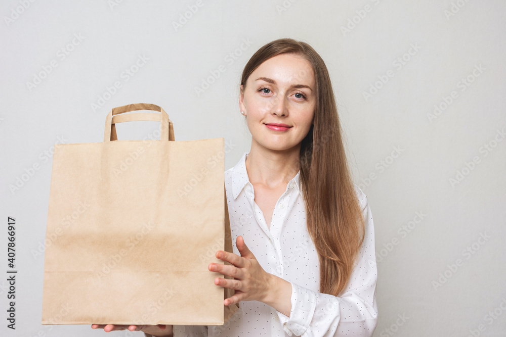 Happy woman shows shopping bags, copy space Happy woman shows shopping bags, copy space