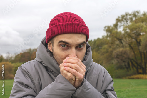 Wallpaper Mural Person freezes on the street, a man is warmly dressed on an autumn seasonal day, portrait, close-up Torontodigital.ca