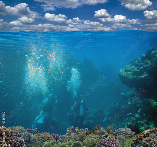Underwater coral reef seabed and water surface with sky