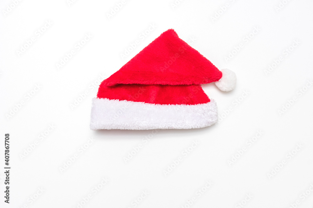 Red Santa hat in white background, copy space, top view, copy space