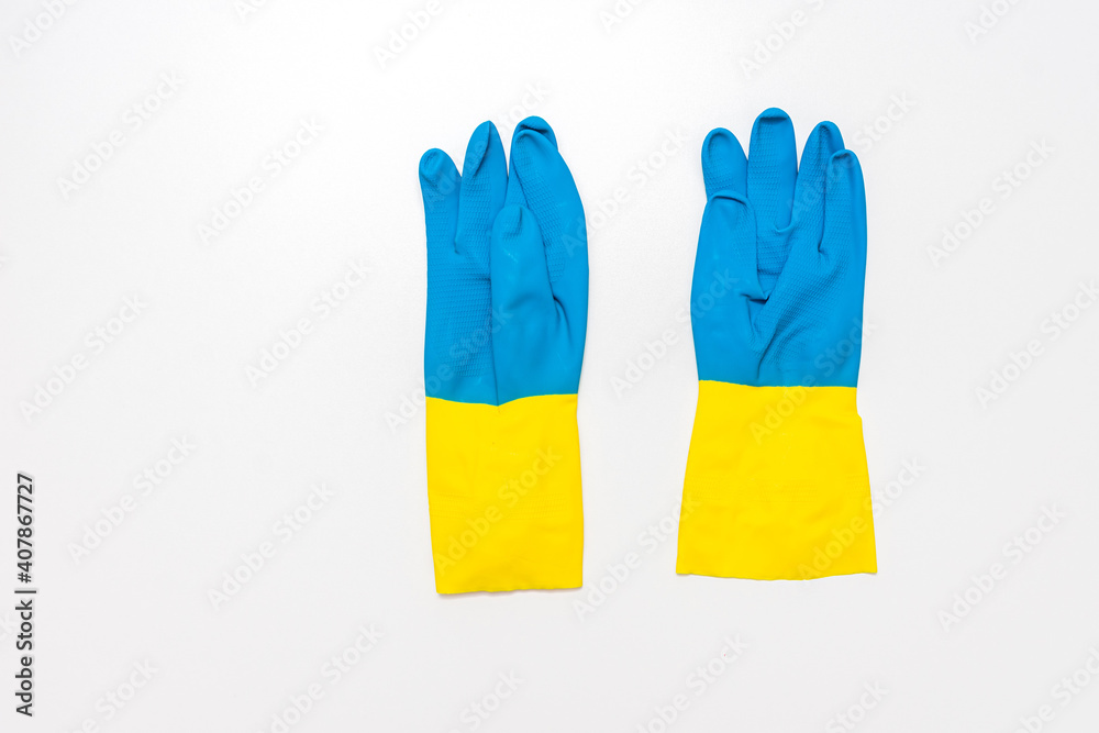 Blue rubber gloves in white background, copy space, top view Blue rubber gloves in white background, copy space, top view
