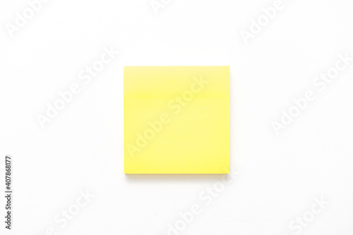 Yellow note paper on white background, copy space
