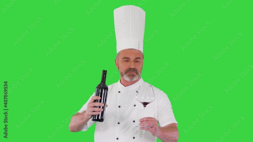 Senior man cook tasting red wine on a Green Screen, Chroma Key. Senior man cook tasting red wine on a Green Screen, Chroma Key.
