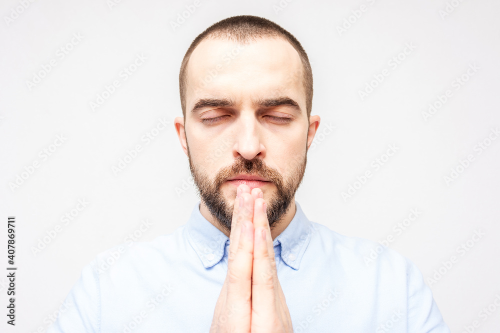 Baptist man praying hard, religious man, copy space, portrait, white background, close-up Baptist man praying hard, religious man, copy space, portrait, white background, close-up