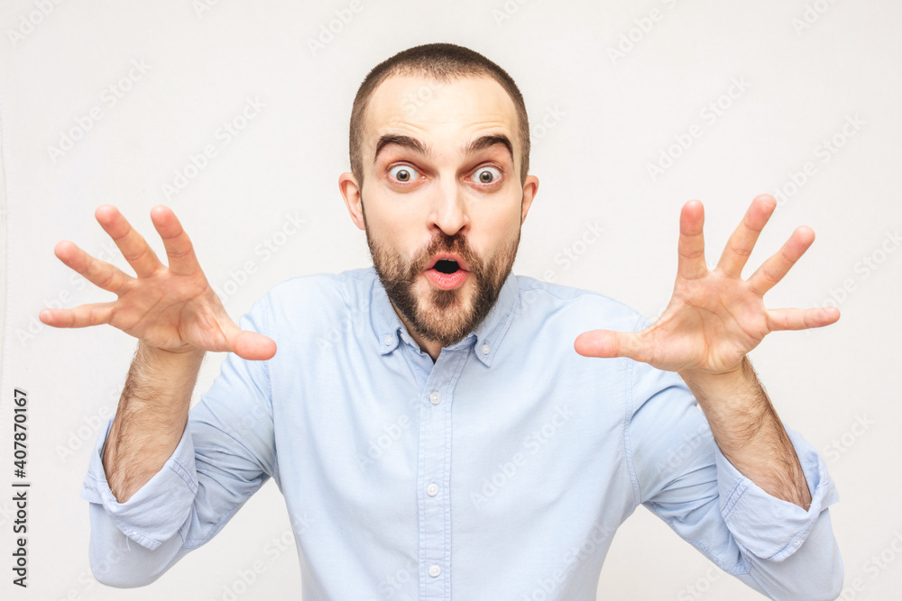Olfactory bearded man scares someone and plays hide-and-seek, the man says: Boo! portrait, copy space Olfactory bearded man scares someone and plays hide-and-seek, the man says: Boo! portrait, copy space
