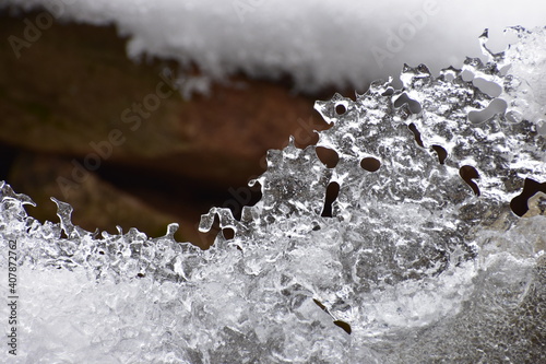 Closeup of ice pattern melting on winter day