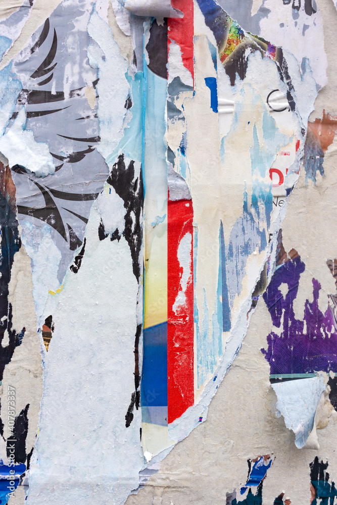 Fototapeta premium Old torn, ruined and crumpled street poster. Urban background