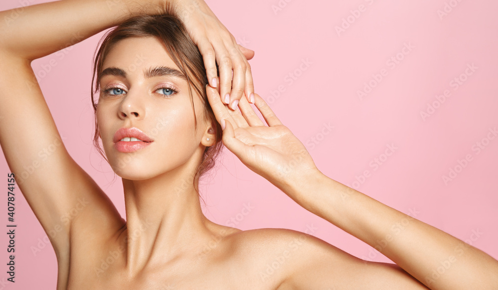 Mockup of young woman with nude skin posing naked on pink background, showing natural makeup and healthy glowing face after cleansing and cosmetic treatment Mockup of young woman with nude skin posing naked on pink background, showing natural makeup and healthy glowing face after cleansing and cosmetic treatment