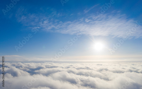 Aerial view white clouds in blue sky. Aerial top view cloudscape. Texture of clouds. View from above. Clouds texture background. Panorama clouds texture