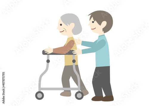 歩行器を使う高齢女性と男性職員