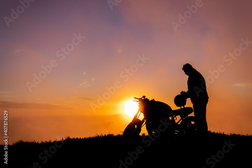 Motorbiker in the sunset, Azores, Sao Miguel island, silhouette.