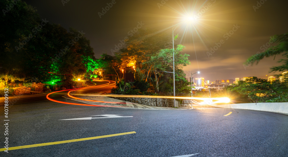 Night view of highway curve and garden landscape