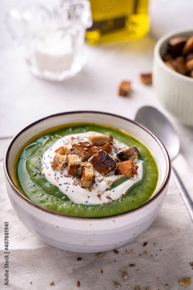 Rustic spinach and broccoli rich soup puree with cream and croutons Rustic spinach and broccoli rich soup puree with cream and croutons