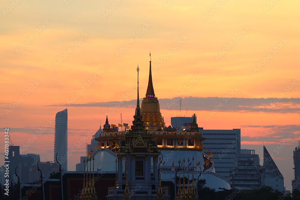 Phu Khao Thong or the Golden Mount of Wat Saket Temple against Fantastic Sunset Sky, Bangkok, Thailand