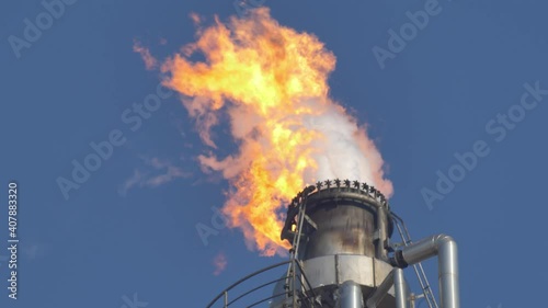Fire Burning on Top of Gas Flare Stack Chimney in Petroleum Refinery Slow Motion