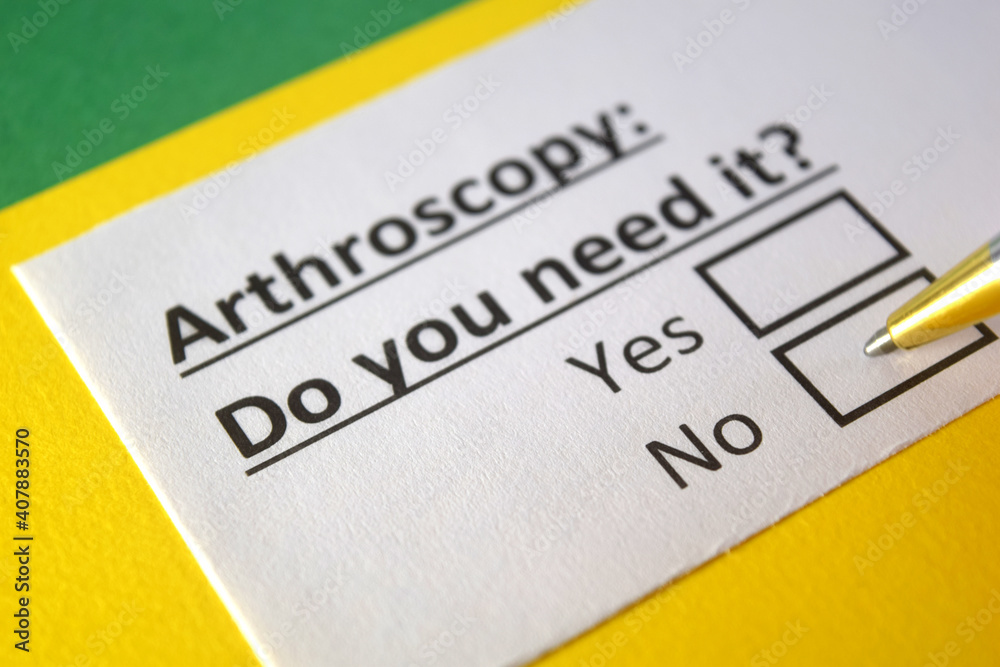 One person is answering question about arthroscopy. One person is answering question about arthroscopy.