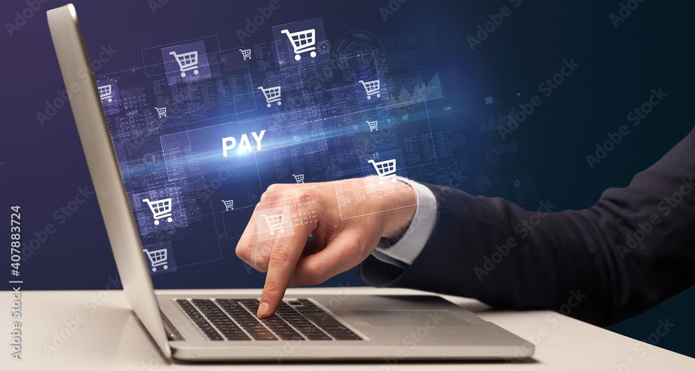 Businessman working on laptop with PAY inscription, online shopping concept Businessman working on laptop with PAY inscription, online shopping concept