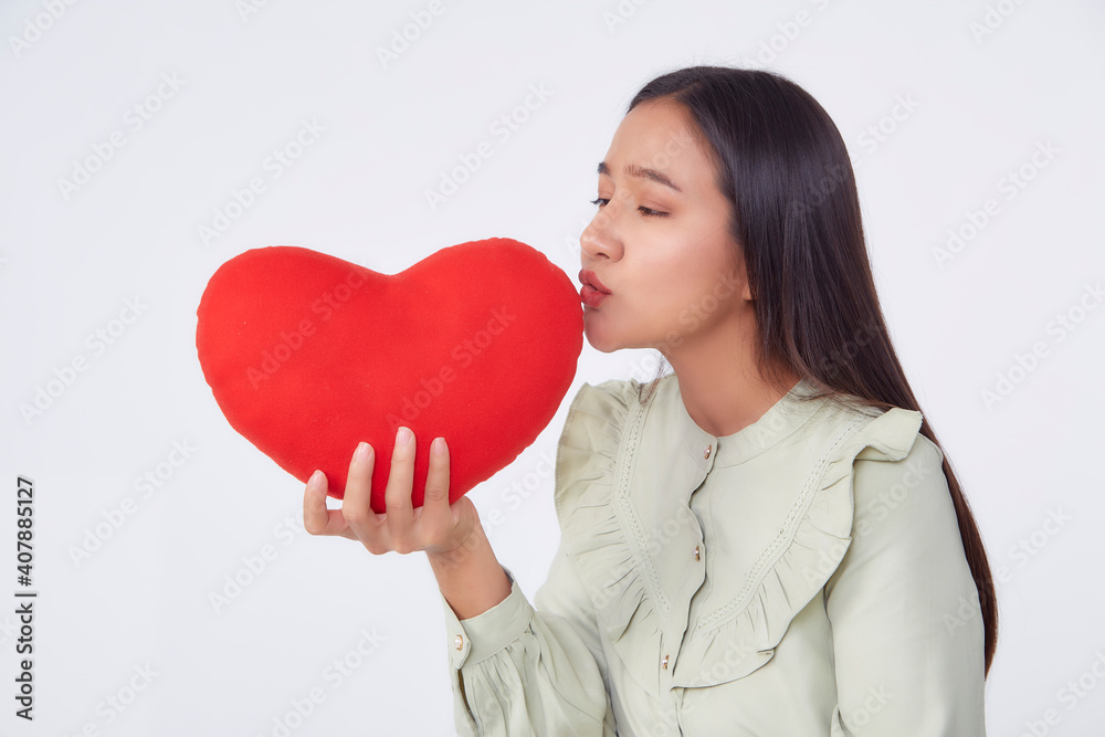 young attractive woman holding a red heart young attractive woman holding a red heart