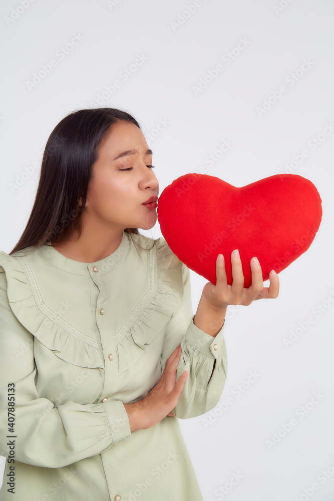 young attractive woman holding a red heart young attractive woman holding a red heart