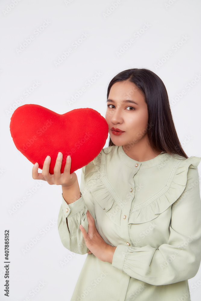 young attractive woman holding a red heart young attractive woman holding a red heart