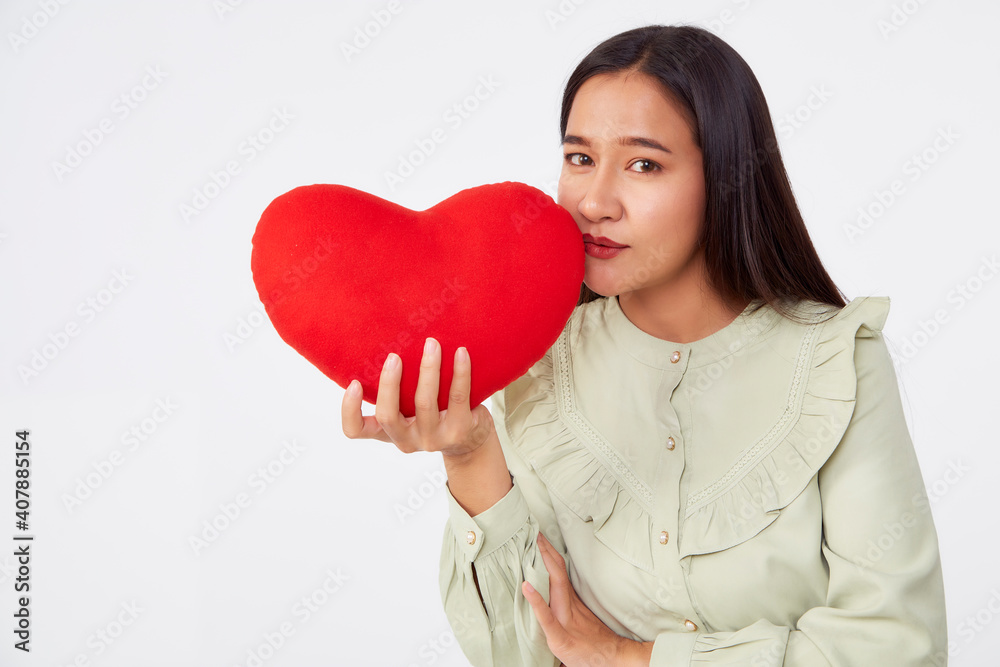 young attractive woman holding a red heart young attractive woman holding a red heart