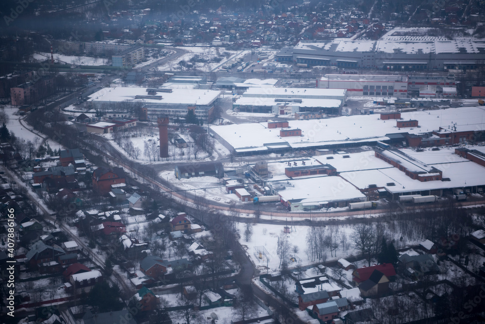 View of the snow-covered suburbs of Moscow from an airplane View of the snow-covered suburbs of Moscow from an airplane
