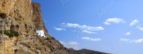 Ultra wide panoramic photo of famous Monastery of Hozoviotissa built in a steep rock in island of Amorgos, Cyclades, Greece photo