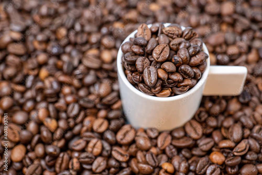 coffee beans close up and a cup full of coffee beans coffee beans close up and a cup full of coffee beans