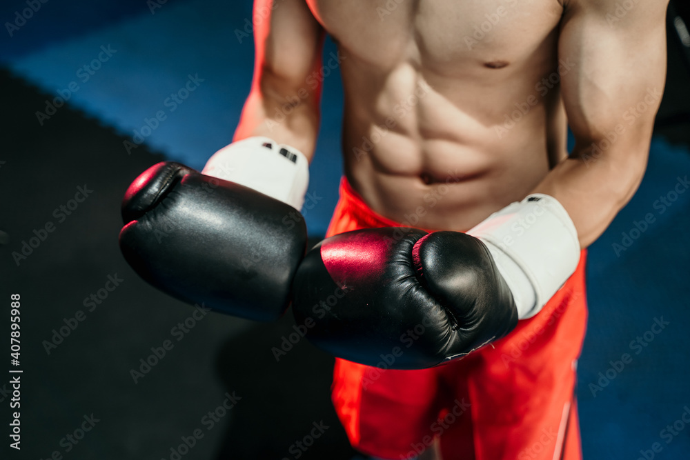 close up of boxer hand's in boxing gloves in the boxing ring background